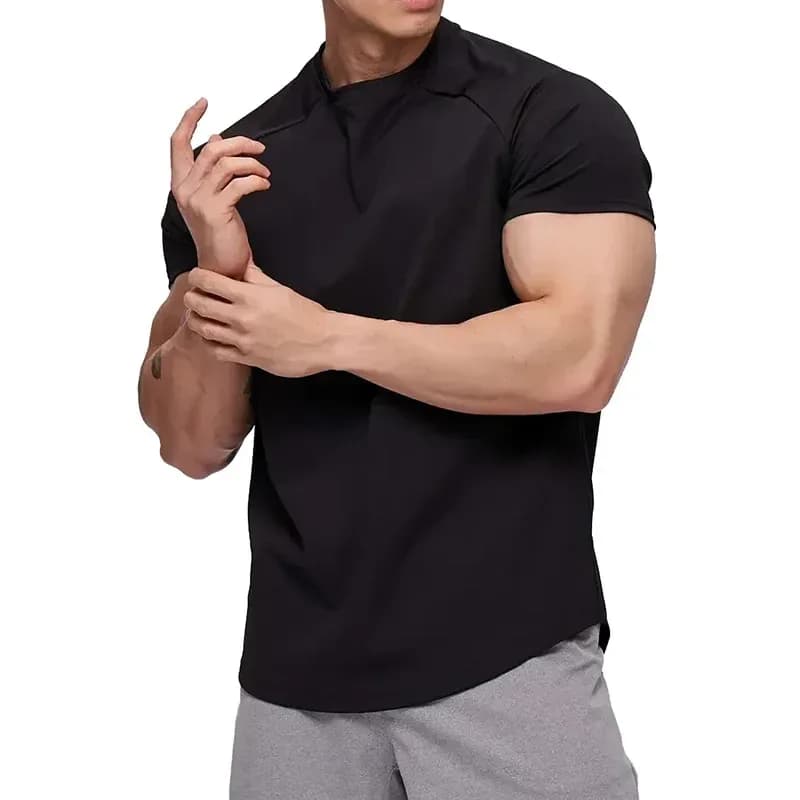 man wearing a black athletic fit gym t-shirt with raglan sleeves