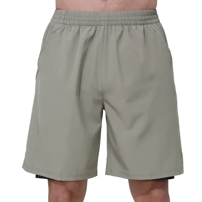 man wearing khaki 2 in 1 gym shorts