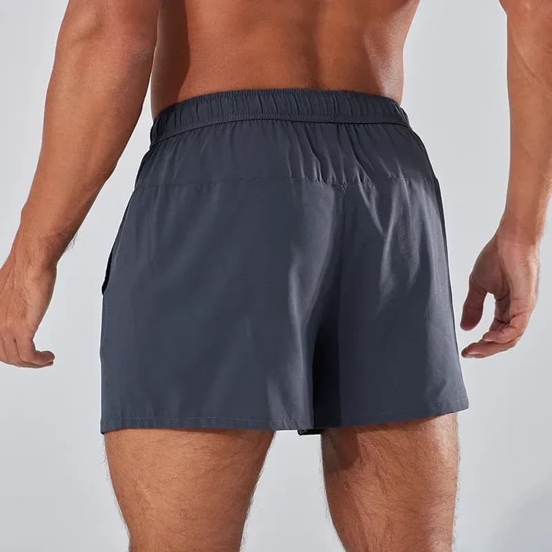 back view of grey quick dry running shorts on a model