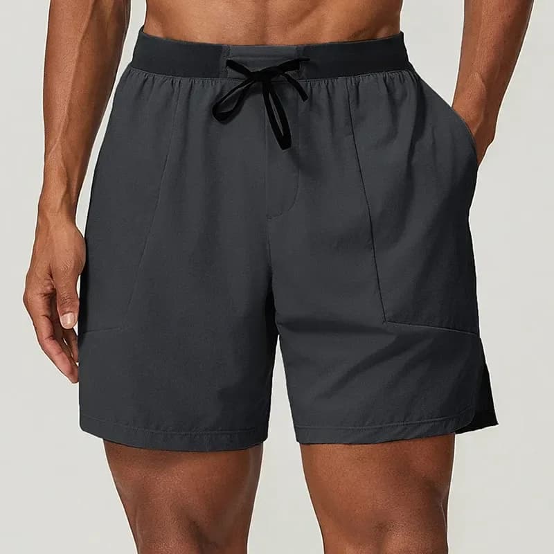 man wearing carbon grey stretch training shorts