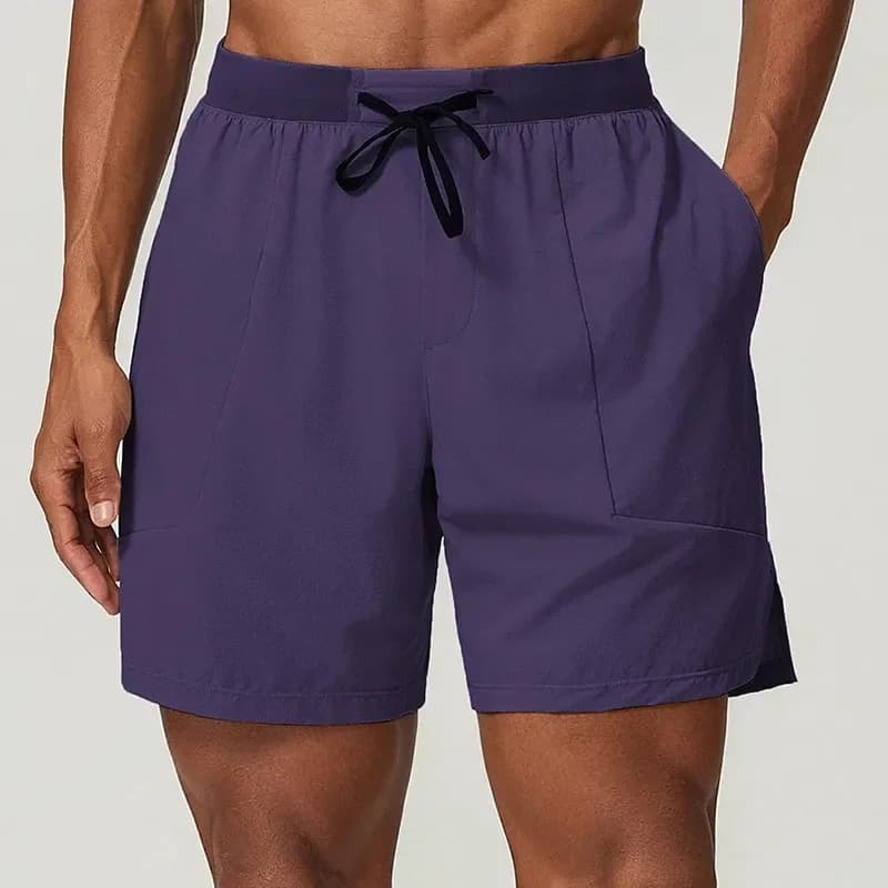 man wearing dark purple stretch training shorts