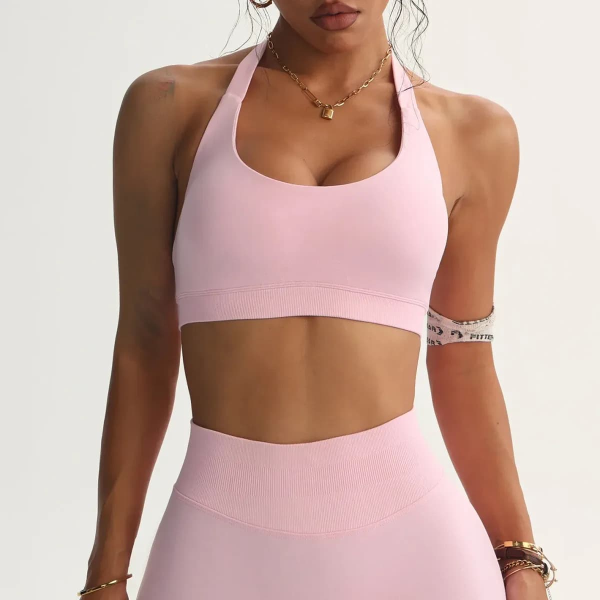 pink halter sports bra with high support and scoop U neckline