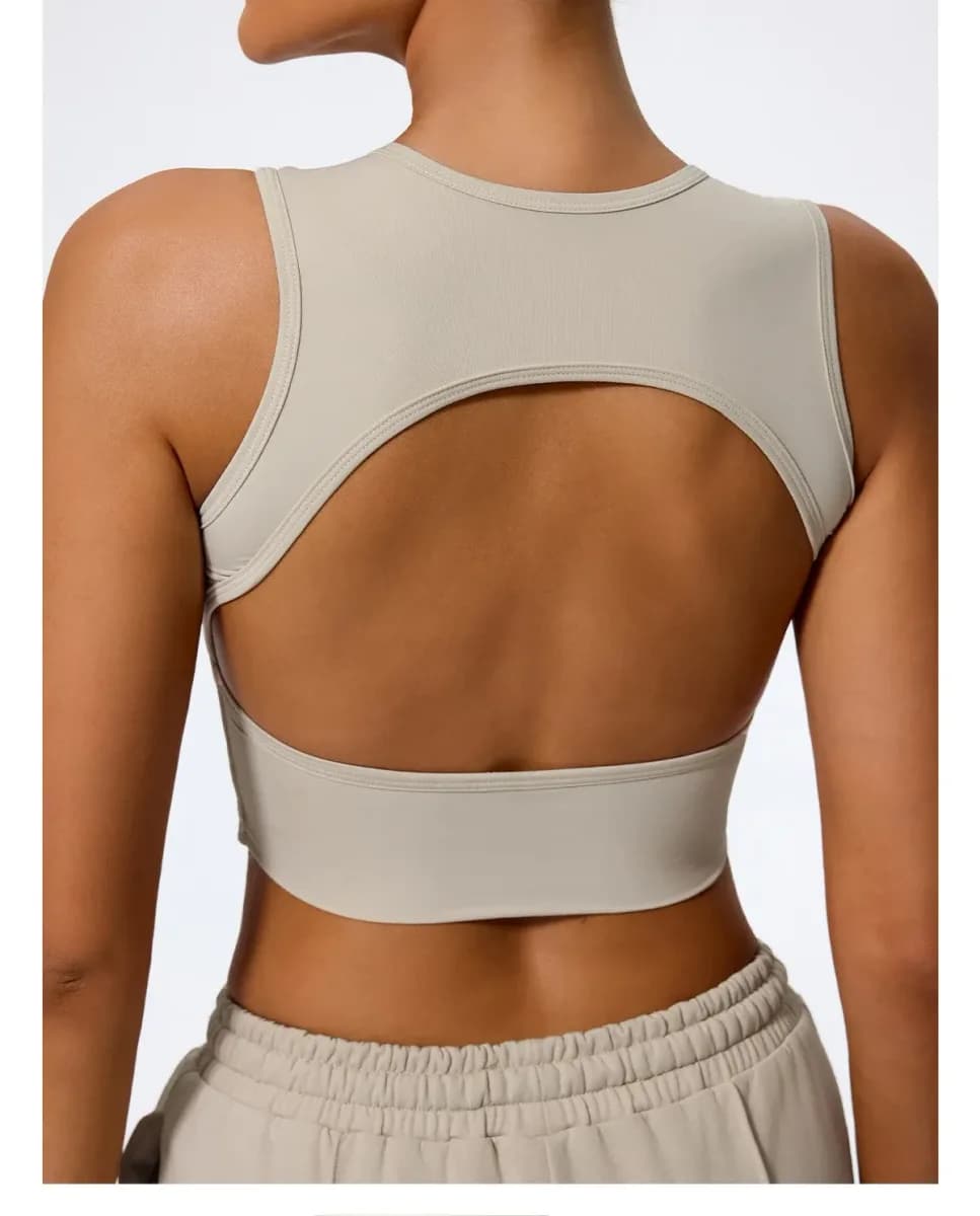 back view of the almond open back crop tank top showing the wide cutout