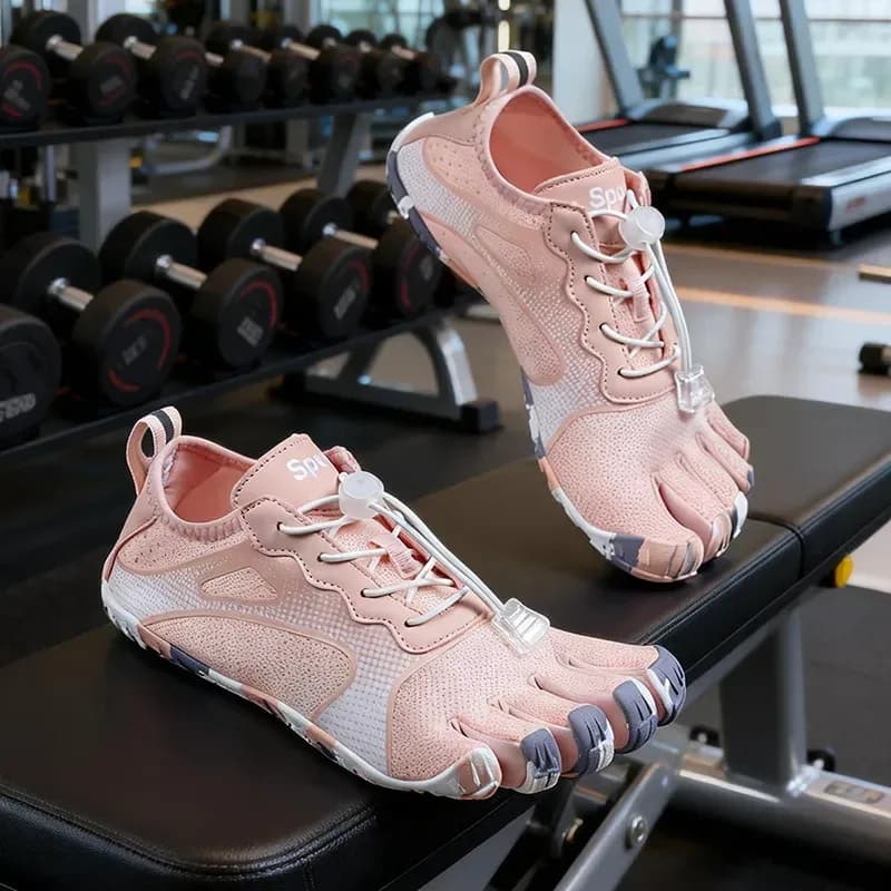 pink print barefoot toe shoes on a gym bench