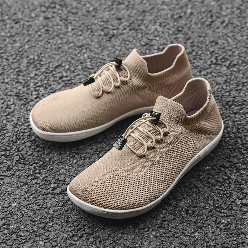pair of khaki barefoot training shoes on pavement