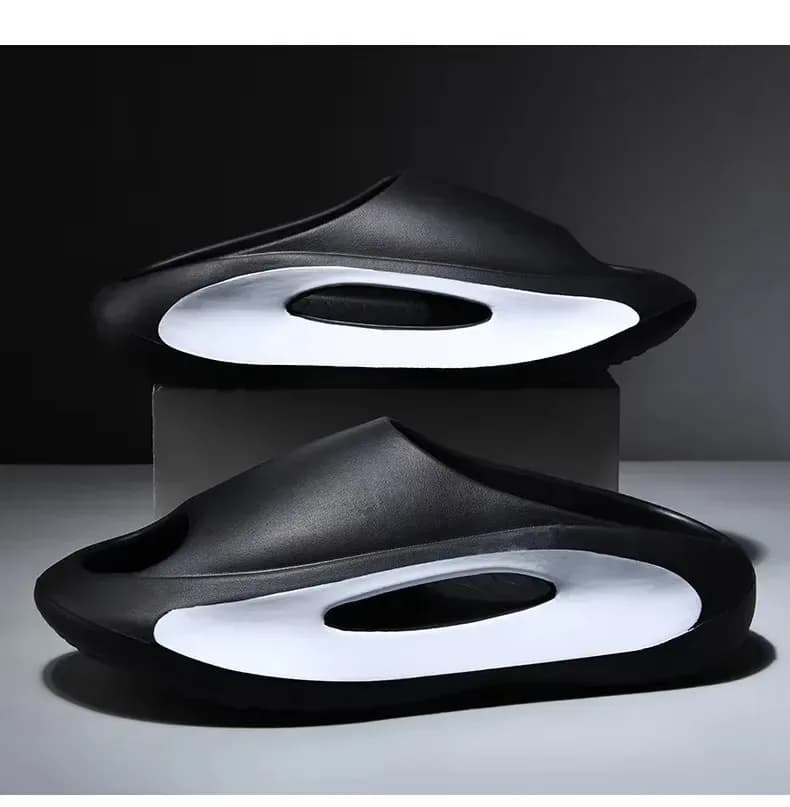 black thick platform eva slides with cutout sole