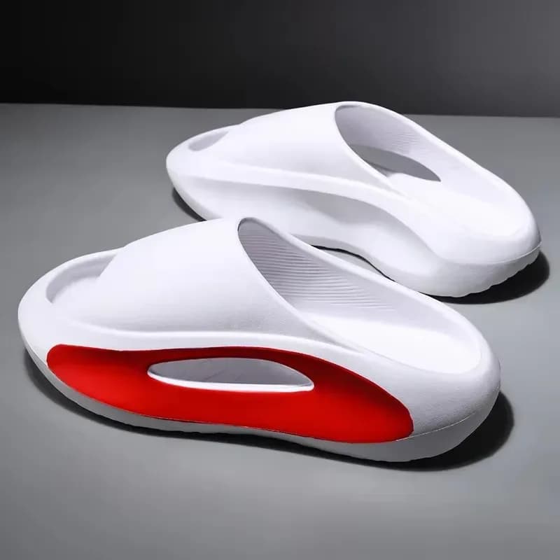 pair of white thick platform eva slides with red cutout