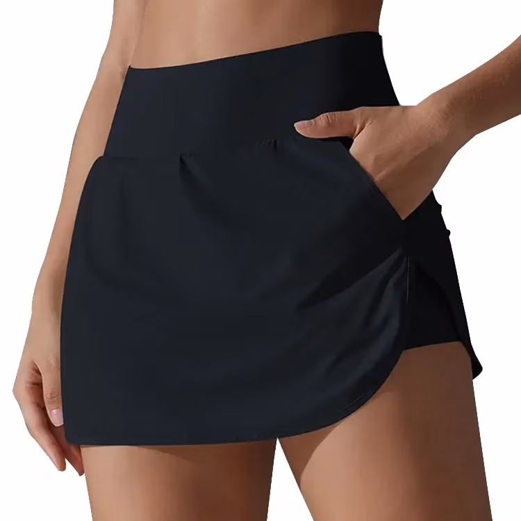 woman wearing a black high waisted athletic skort with a hand in the side pocket