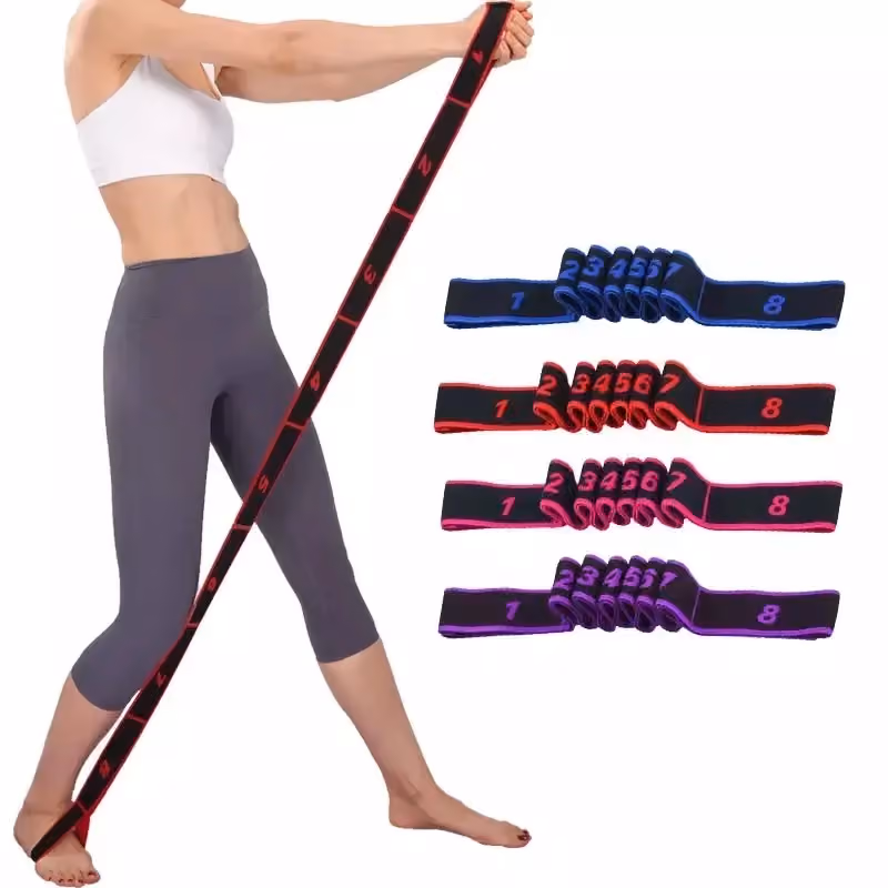 woman using an elastic stretching strap with 8 loops for a standing stretch